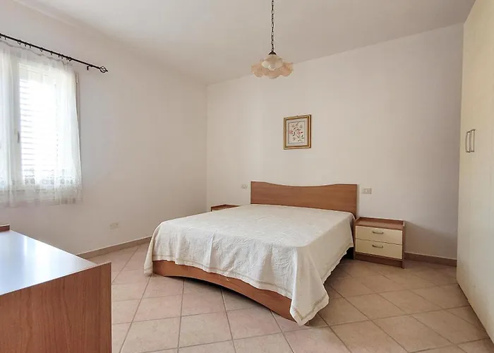 בית נופש Residenza La Pineta אורוסיי